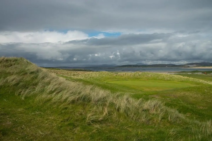 Golf course on Ireland's northwest coast under a cloudy sky